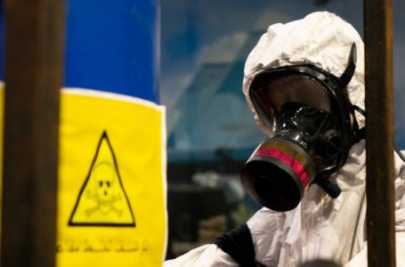 People in protective suits in the laboratory for the production of chemical and biological weapons. The threat of the use of weapons of mass destruction by Arab States.