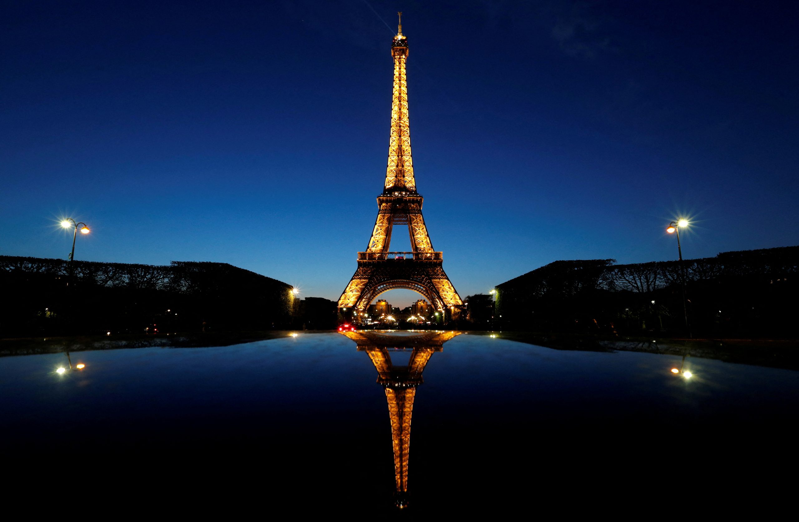 FILE PHOTO: A night view shows the Eiffel tower, reflected in a car’s roof, in Paris, France, April 30, 2016. REUTERS/Christian Hartmann/File Photo